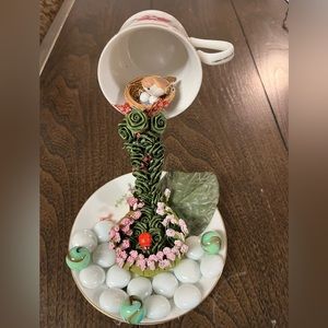 Small tea cup & saucer ornament.